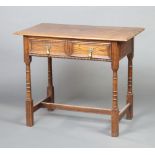 An 18th Century style oak side table with geometric moulding fitted 2 short drawers with pear drop