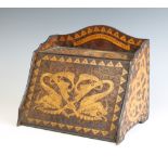 A wooden Art Nouveau Arts and Crafts wedge shaped stationery box, the 3/4 gallery carved a dragon