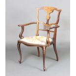 An Edwardian inlaid mahogany open arm chair with vase shaped slat back and Berlin woolwork seat,
