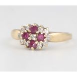 A 9ct yellow gold ruby and diamond cluster ring size M 2.3 grams gross