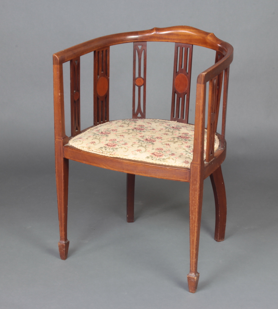 An Edwardian inlaid mahogany tub back chair with upholstered seat, raised on square tapered