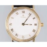 A lady's 14ct yellow gold Titan quartz wristwatch on a leather strap