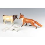 A Beswick standing fox no. 1016A 14cm, red brown and white gloss, together with a ditto bull (