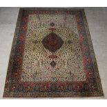 A green and brown floral pattern machine made Persian style carpet with central medallion 364cm x