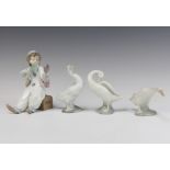 A Lladro figure of a seated boy clown 15cm together with 3 Lladro geese