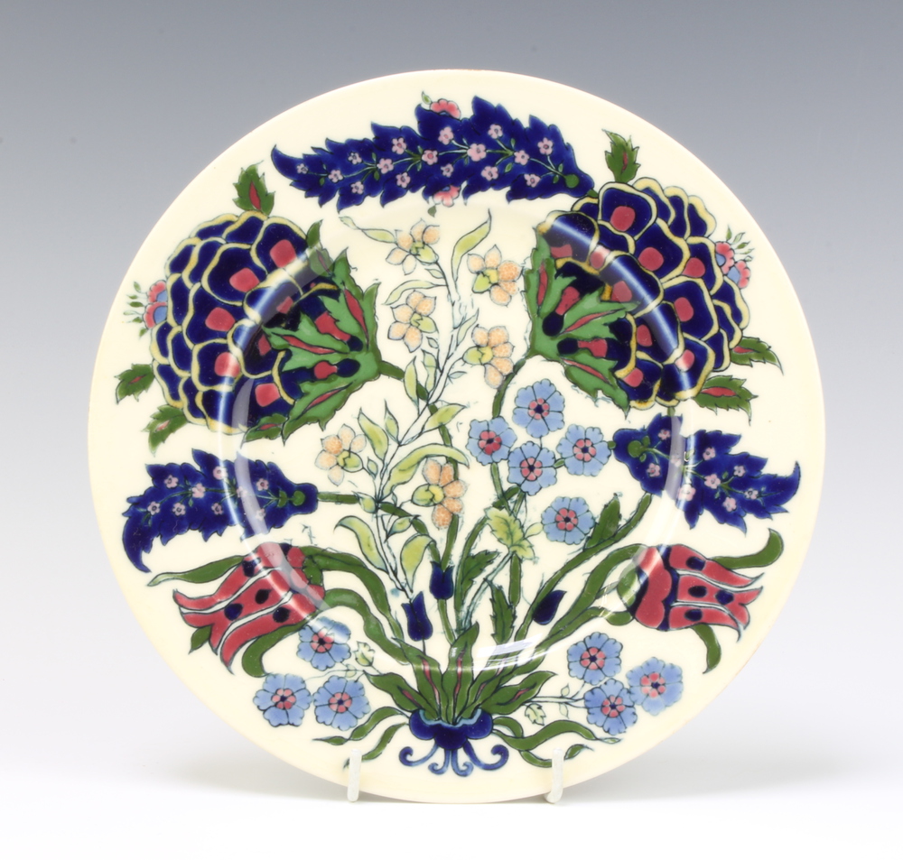 A Zsolnay plate decorated with stylised flowers 21cm