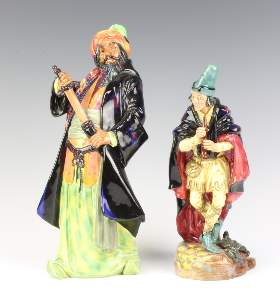 A Royal Doulton figure of The Pied Piper HN2102 24cm and Blue Beard HN2105 27cm