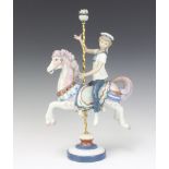 A Lladro figure of a boy on carousel horse no.1470 40cm There are minor chips to the flowers