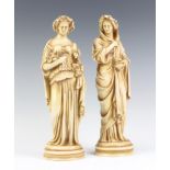 A pair of 19th Century German porcelain figures of classical ladies on circular bases 26cm