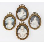 Miniatures, oval watercolours on ivory, studies of four ladies, contained in a cast gilt metal