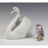 A Lladro figure of a swan 5231 18cm and a ditto of an owl sitting on a branch 9cm