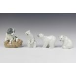 A Lladro figure of a standing polar bear 10cm and 2 seated ditto 9cm and a Nao group of 2 puppies