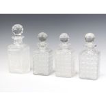 A set of 3 cut glass square spirit decanters and stoppers 23cm, a single ditto 26cm The first 3