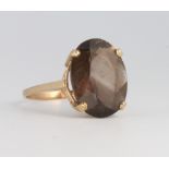 A 9ct yellow gold smoky quartz dress ring size P