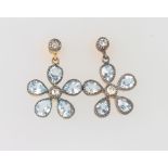 A pair of silver gilt, blue topaz and diamond daisy style ear studs, 12mm