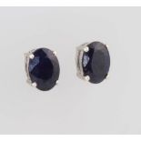 A pair of silver sapphire ear studs