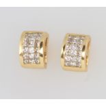 A pair of 18ct yellow gold diamond set ear studs