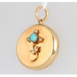 An Edwardian 15ct yellow gold turquoise and diamond circular locket 9 grams