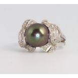 A white gold, grey pearl and diamond dress ring size O