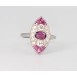 A platinum, diamond and ruby marquise shape ring set with an oval cut ruby and flanked by princess