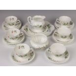 A Minton part tea set with multi floral decoration comprising 6 tea cups, 6 saucers, 5 side