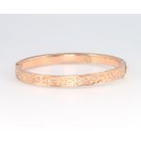 A 9ct yellow gold engine turned bangle 8.2 grams