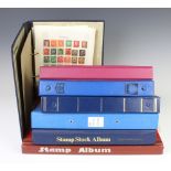 Six albums of world stamps together with a stock book of world stamps