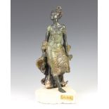 After L M Lafuente, a Spanish limited edition bronze figure of a lady seated by a rocky outcrop 37cm