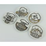 Five Fornasetti coasters decorated with spirit labels 11cm