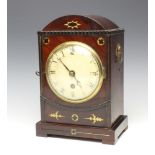 A 19th Century single fusee bracket timepiece with plain 10cm brass back plate, contained in an arch
