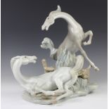An impressive Lladro group of 2 horses playing 37cm