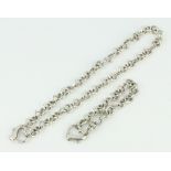 A silver heart shaped bracelet and necklace, 65 grams