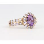A 9ct yellow gold amethyst and gem set ring 2.6 grams, size L