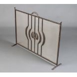 An Art Nouveau wrought iron and mesh spark guard 66cm h x 92cm w x 21cm
