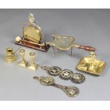 A 19th Century brass chamber stick, 2 brass squat candlesticks, tea gong, martingale hung 3 horse