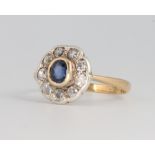 An 18ct yellow gold sapphire and diamond cluster ring, size L, 2.4 grams