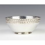 A Liberty & Co hammer pattern silver bowl with rope twist rim, Birmingham 1912, 11.5cm, 161 grams