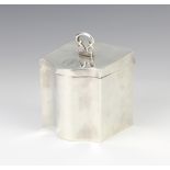 A silver serpentine box/tea caddy Birmingham 1917, 8cm, 162 grams The lid is broken and the box is