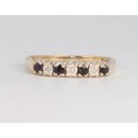 A 9ct yellow gold sapphire and diamond ring size M