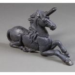 A Victorian cast iron boot scraper in the form of a seated unicorn 41cm h x 60cm w x 30cm d