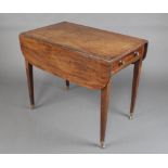 A Georgian mahogany Pembroke table fitted a drawer, raised on square tapered supports ending in