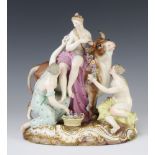 A late 19th Century Meissen figure group Europa and the bull depicting 3 semi-clad ladies,raised