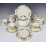 A Royal Doulton Juliet tea and dinner service comprising 8 tea cups, 8 saucers, 8 small plates, 8
