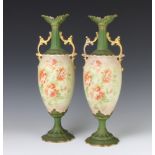 A pair of Edwardian Continental two handled vases decorated with roses 39cm
