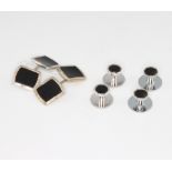 A pair of 9ct white gold onyx cufflinks and a pair of ensuite studs, together with a pair of white
