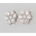 A pair of 18ct white gold 7 stone diamond cluster ear studs, approx. 0.8ct, 10mm