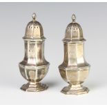 A near pair of octagonal silver pepperettes, 100 gramsThe hallmarks are rubbed
