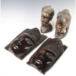 Two African carved wooden portrait busts of ladies 24cm x 13cm x 8cm together with 2 ditto carved