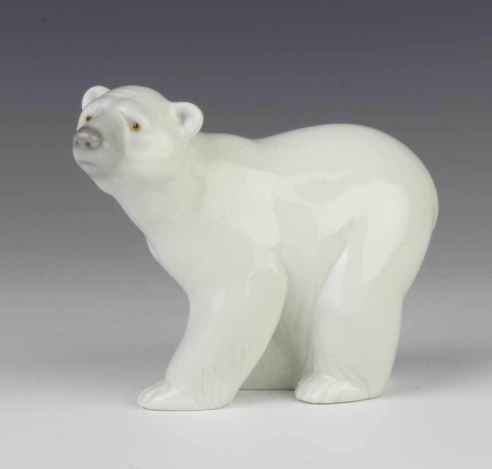 A Lladro figure of a standing polar bear cub 9cm