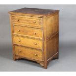 An oak chest of four long drawers with linen fold decoration and turned handles 99cm h x 80cm w x